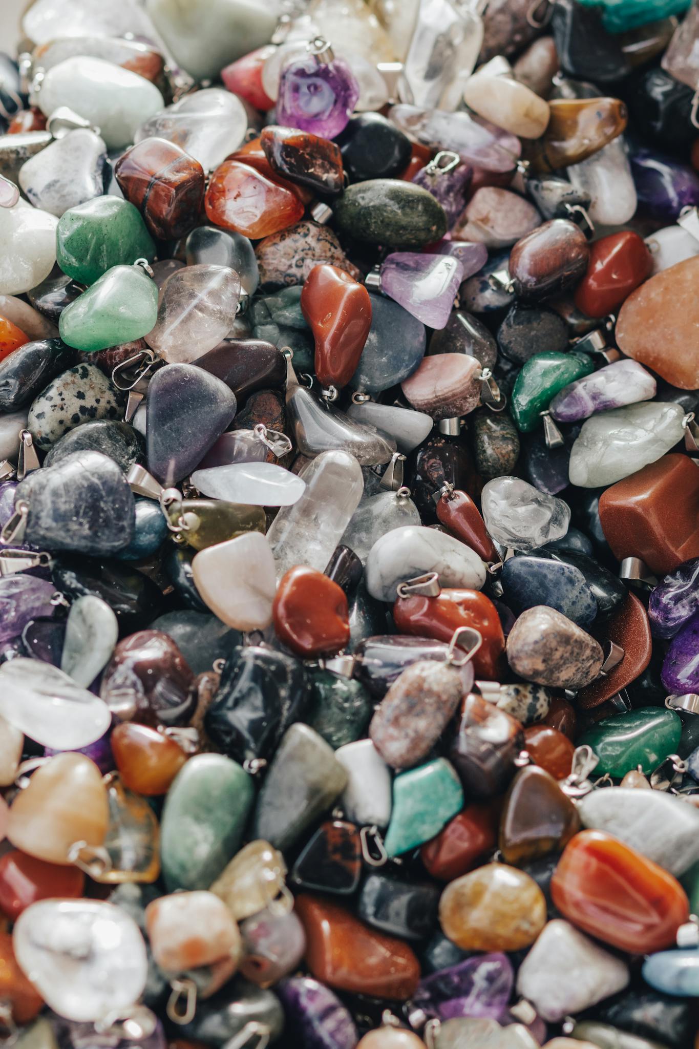 A colorful assortment of polished gemstones, perfect for jewelry making or decor.